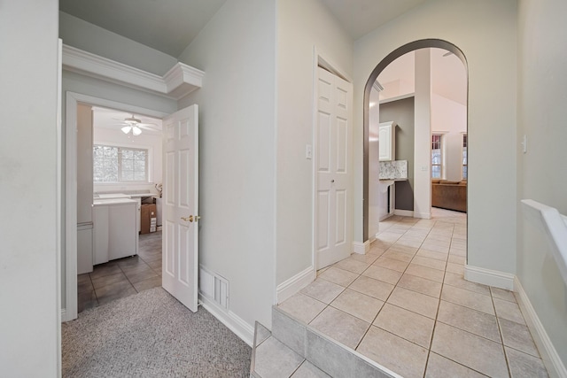 corridor with light tile patterned flooring