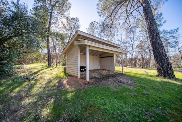 view of outdoor structure with a lawn