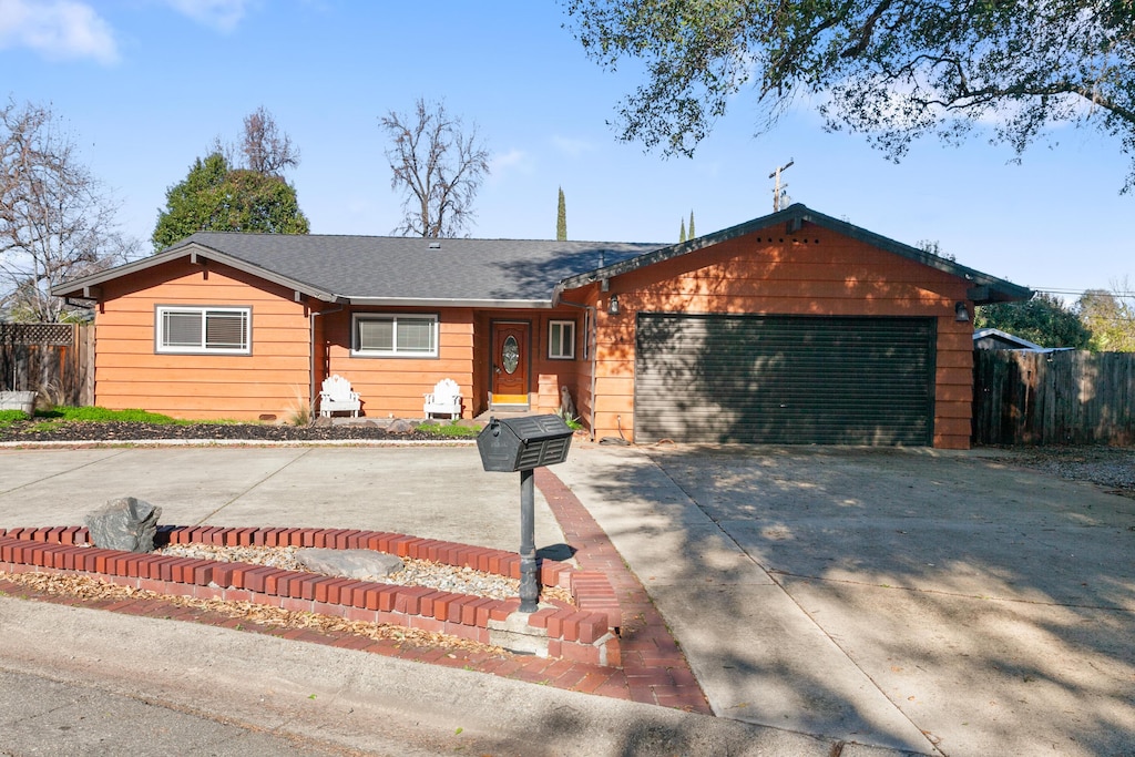 ranch-style house featuring a garage