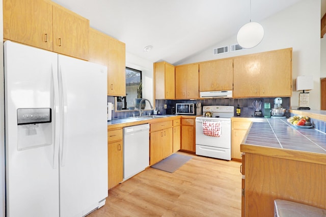 kitchen with light hardwood / wood-style floors, white appliances, lofted ceiling, pendant lighting, and sink