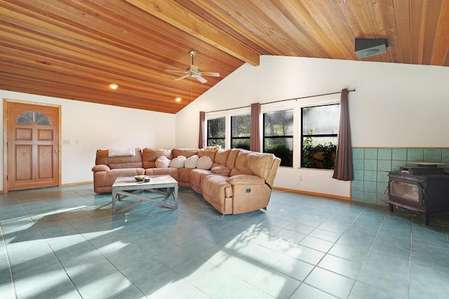 tiled living room with ceiling fan, a wood stove, lofted ceiling with beams, and wood ceiling