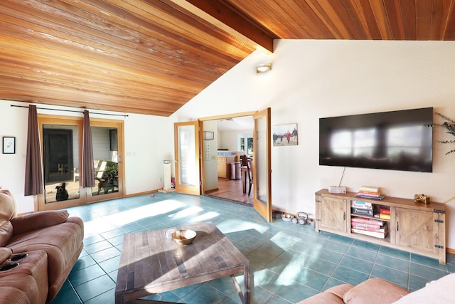 living room with vaulted ceiling with beams, dark tile patterned flooring, and wooden ceiling