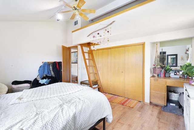 bedroom featuring ceiling fan, a closet, and light hardwood / wood-style flooring