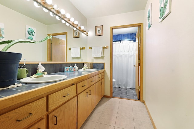 bathroom with curtained shower, tile patterned floors, vanity, tasteful backsplash, and toilet