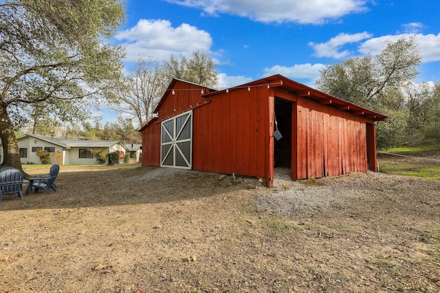 view of outdoor structure featuring a lawn