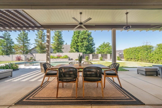 view of patio featuring ceiling fan and a fenced in pool