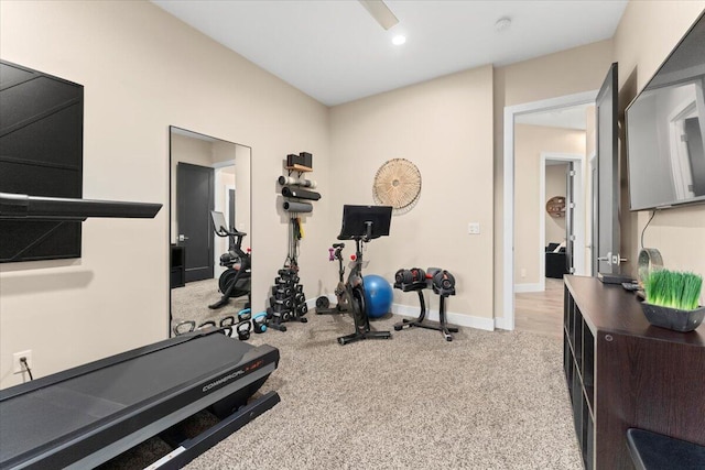 workout room featuring light colored carpet