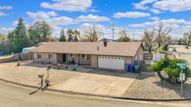 ranch-style home featuring a garage