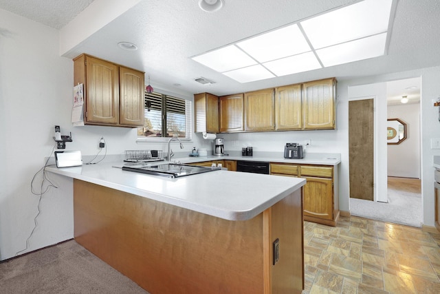 kitchen featuring light colored carpet, black appliances, and kitchen peninsula