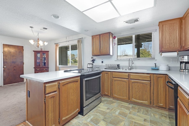 kitchen featuring sink, decorative light fixtures, black dishwasher, kitchen peninsula, and electric stove