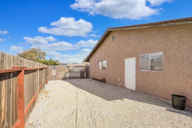 view of side of property featuring a patio area