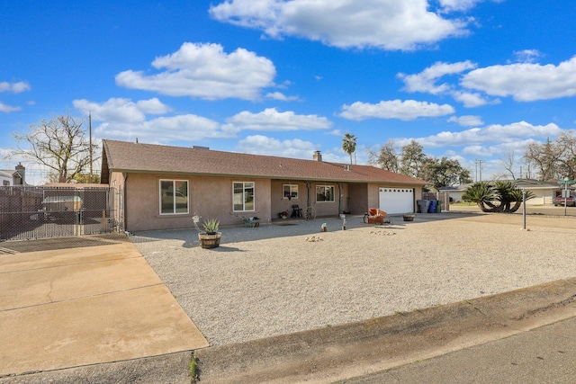 ranch-style house featuring a garage