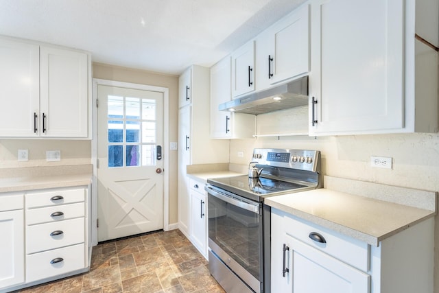 kitchen featuring white cabinetry and stainless steel electric range