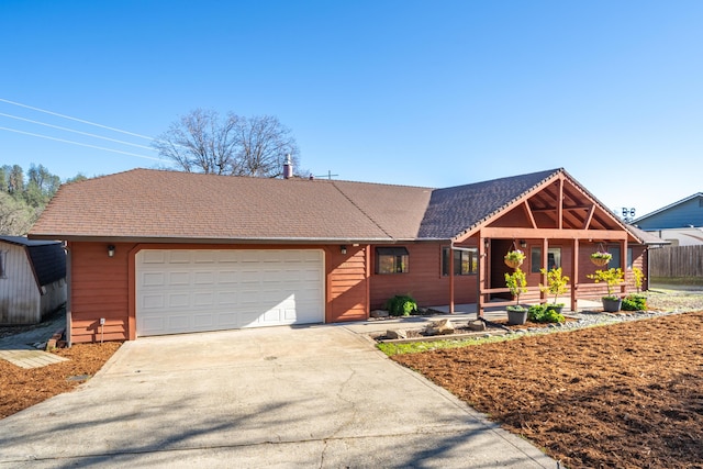 ranch-style house with a garage and a porch