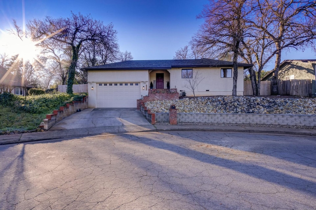 ranch-style home with a garage