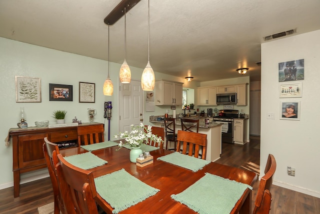 dining space featuring dark hardwood / wood-style floors