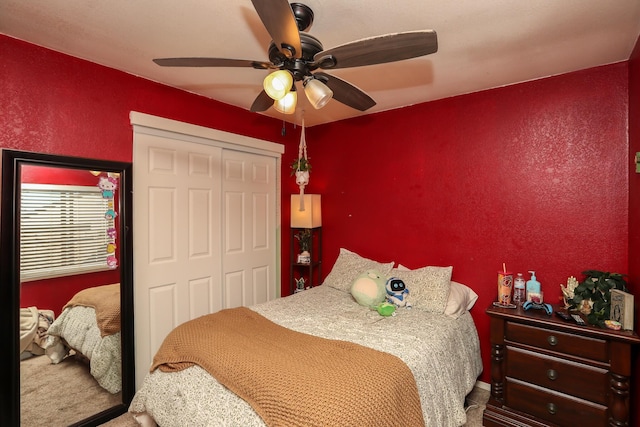 bedroom with carpet flooring, a closet, and ceiling fan