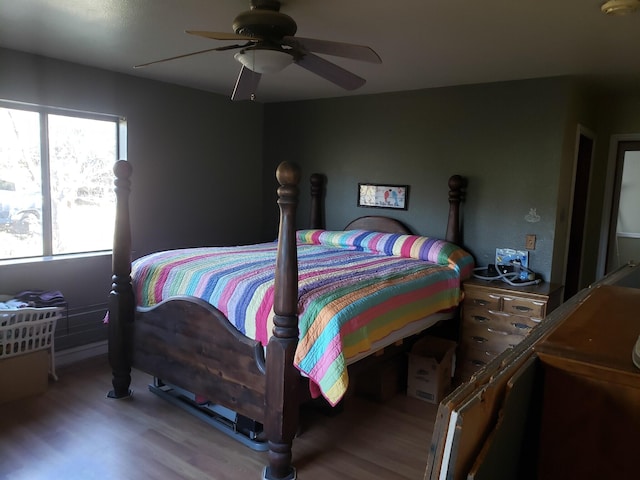 bedroom featuring wood-type flooring and ceiling fan