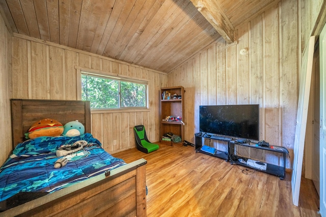 bedroom featuring wood-type flooring, wood walls, vaulted ceiling with beams, and wood ceiling