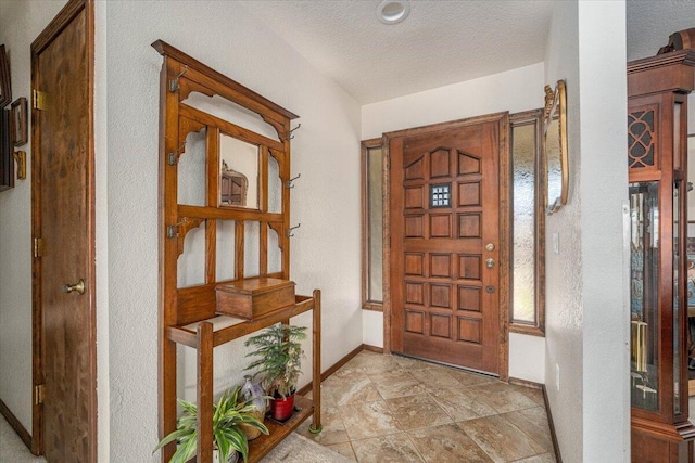 entryway featuring a textured ceiling