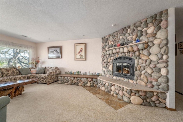 carpeted living room with a textured ceiling and a fireplace