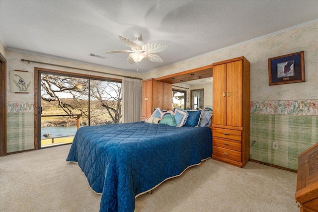 bedroom with ceiling fan, light carpet, and multiple windows