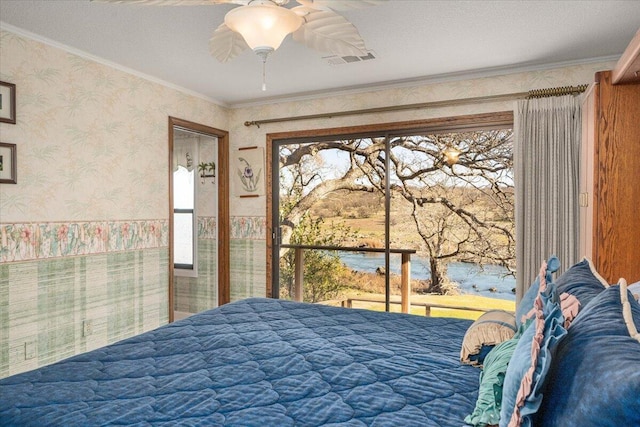 bedroom featuring ceiling fan and crown molding