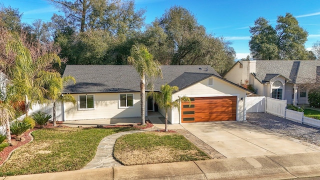 view of front of property with a front lawn and a garage