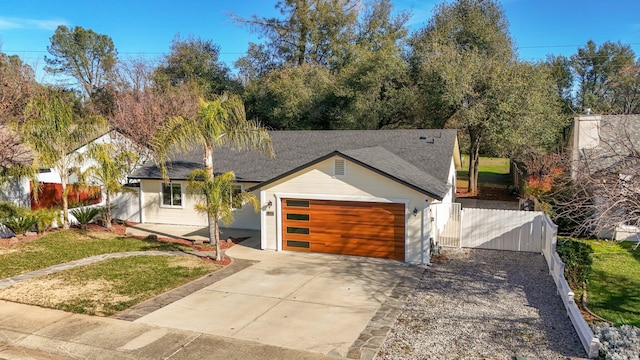 view of front facade featuring a garage and a front lawn