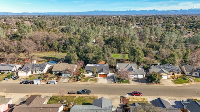 birds eye view of property featuring a mountain view