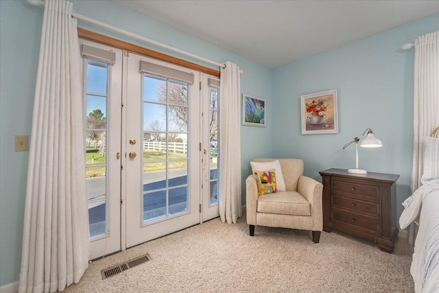 living area featuring light colored carpet