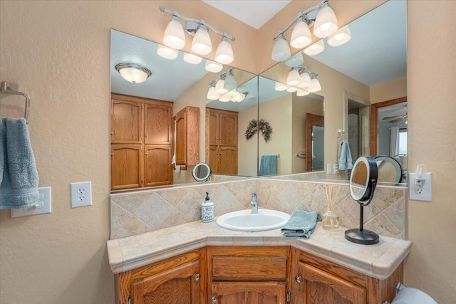 bathroom featuring backsplash and vanity