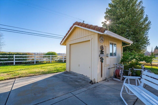 garage featuring a yard