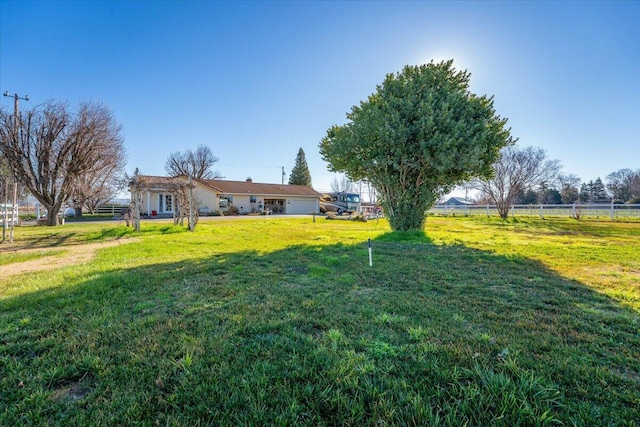 view of yard with a rural view