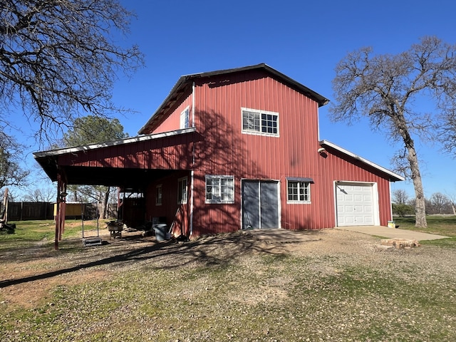 exterior space with a garage and a yard