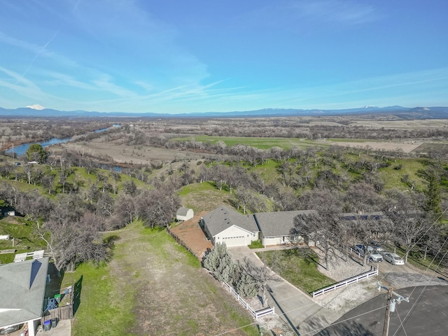 bird's eye view with a water and mountain view