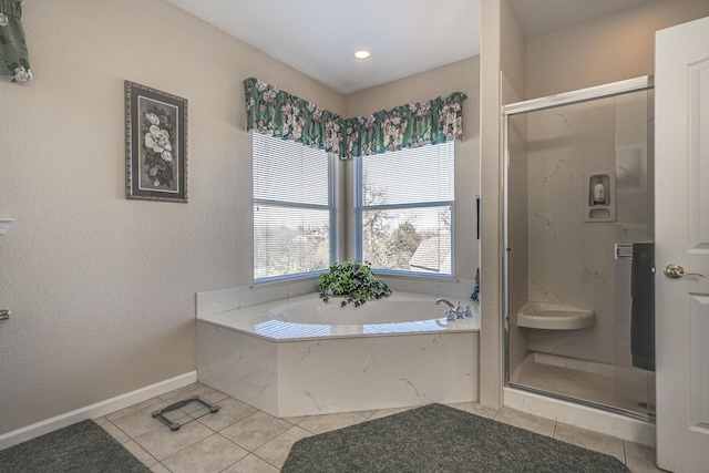 bathroom with tile patterned floors and separate shower and tub