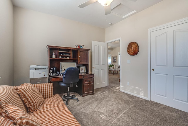 carpeted office featuring ceiling fan