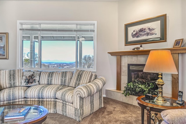 living room featuring carpet floors and a fireplace