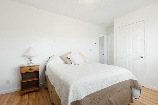 bedroom featuring light wood-type flooring