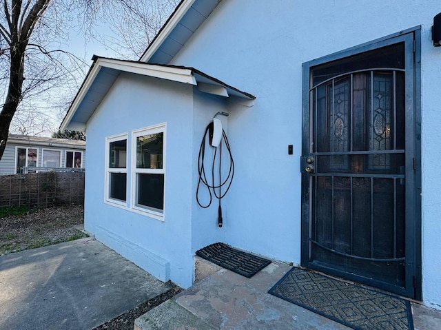 doorway to property with a patio area