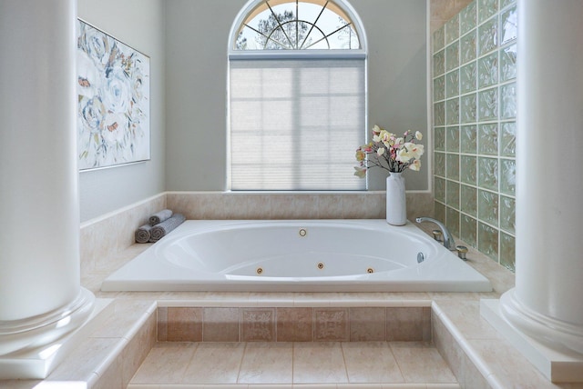 bathroom featuring tiled tub