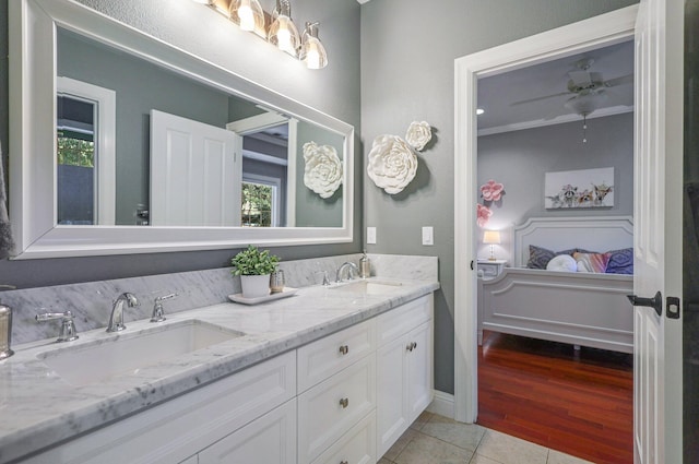 bathroom with ceiling fan, ornamental molding, tile patterned floors, and vanity