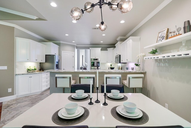 dining area featuring crown molding