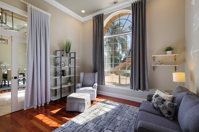 sitting room featuring crown molding and dark hardwood / wood-style floors