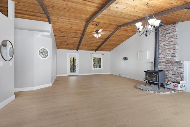 unfurnished living room featuring beamed ceiling, wood-type flooring, high vaulted ceiling, and a wood stove