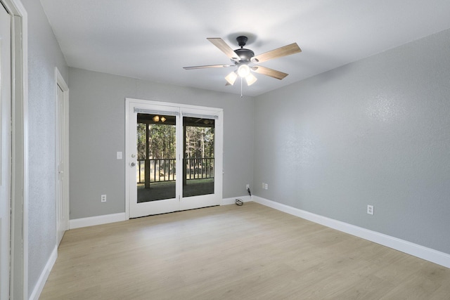 spare room with light hardwood / wood-style flooring and ceiling fan