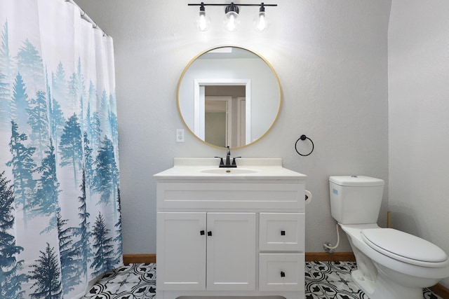 bathroom with a shower with curtain, tile patterned floors, vanity, and toilet