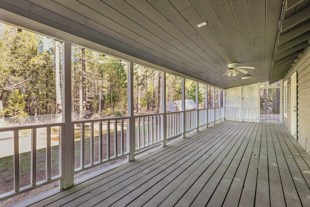 wooden deck featuring ceiling fan