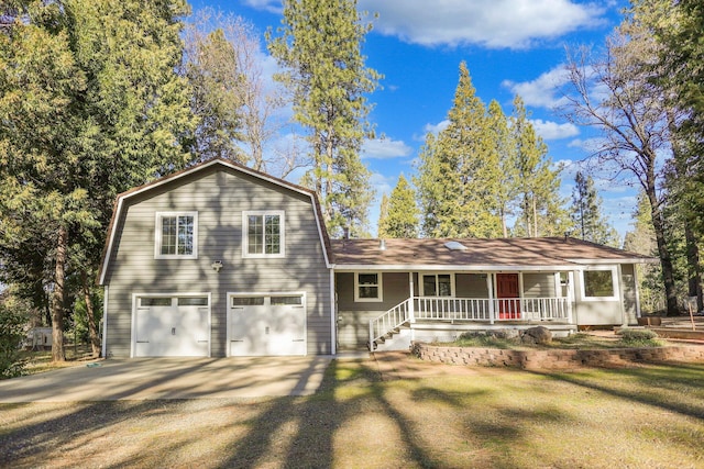 view of front of house featuring a garage, covered porch, and a front lawn